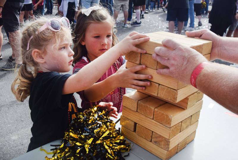 Young Hawkeye and Cyclone fans participate in games during RVTV celebrations on Sept. 4 in downtown Newton.