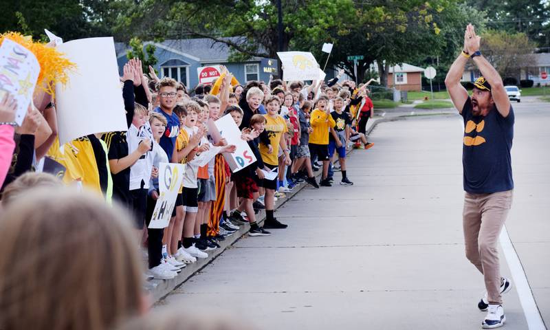 Teachers at Berg Middle School hype up students on Sept. 4 while dressed in Hawkeye and Cyclone gear in preparation for RVTV coming to town.