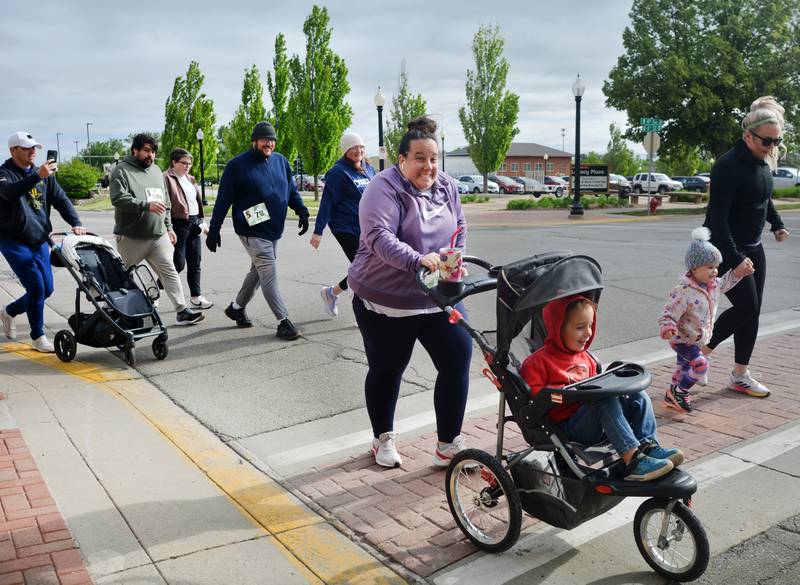 Runners participate in The Phoenix Phase Initiative's fifth annual Run For Her Life 5K and Half-Marathon on May 17 at Legacy Plaza in Newton. More than 110 people showed up for the run.