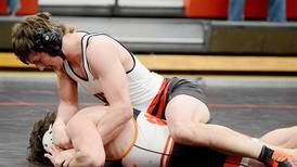 Cardinal grapplers improve fight in loss to Grinnell