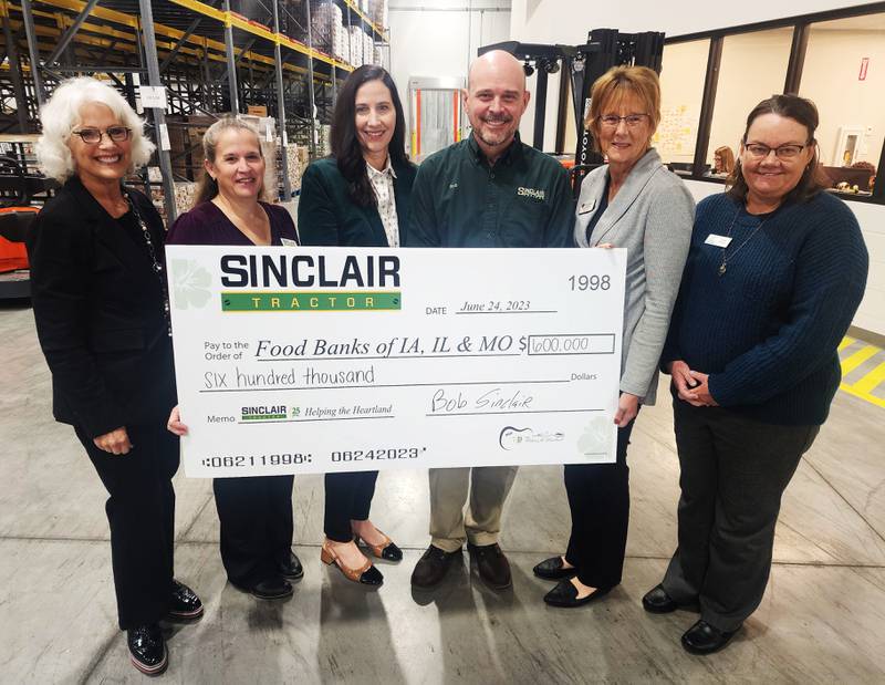 Pictured from left: Michelle Book, Food Bank of Iowa; Darian Graff, Susan Sinclair and Bob Sinclair, Sinclair Tractor; Nancy Renkes, River Bend Food Bank and Barb Prather, Northeast Iowa Food Bank.