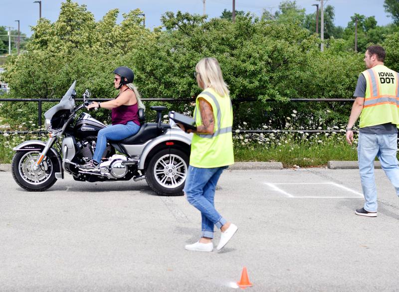 Iowa Department of Transportation employees conduct a motorcycle license test on July 7 in a DMACC-owned lot next to the Centre for Arts & Artists. Jasper County has resumed the tests after establishing the new course.