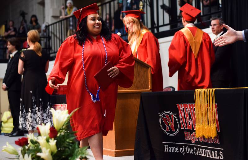 The Newton High School Class of 2024 seniors walk the stage during commencement on May 19 inside the high school gymnasium.