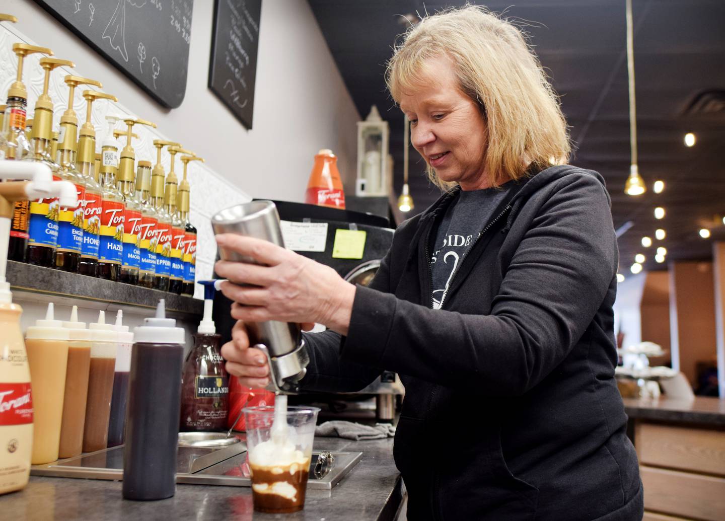 Juli Stanford, owner of West Side Java Co., opened the downtown Newton coffee shop in October 2022. The building was previously occupied by Bridgehouse Coffee Co.