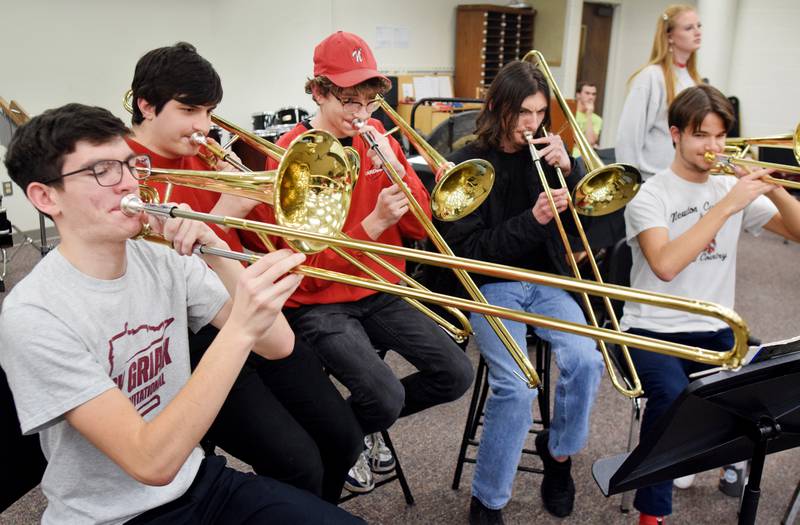 Newton alumni and students have a jam session on Dec. 16 in the band room of Newton High School. Current and past members of the Newton High School band on Dec. 16 participated in the inaugural Alumni Pep Band Night. Adam Kallal, the band director at Newton High School, organized the event in hopes it would become an annual celebration.