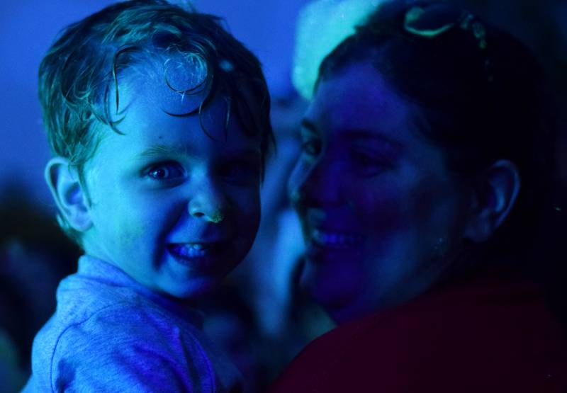 Kids participate in Driving Cap Entertainment's UV Glow Foam Party during Newton Fest on June 9 in Maytag Park in Newton.