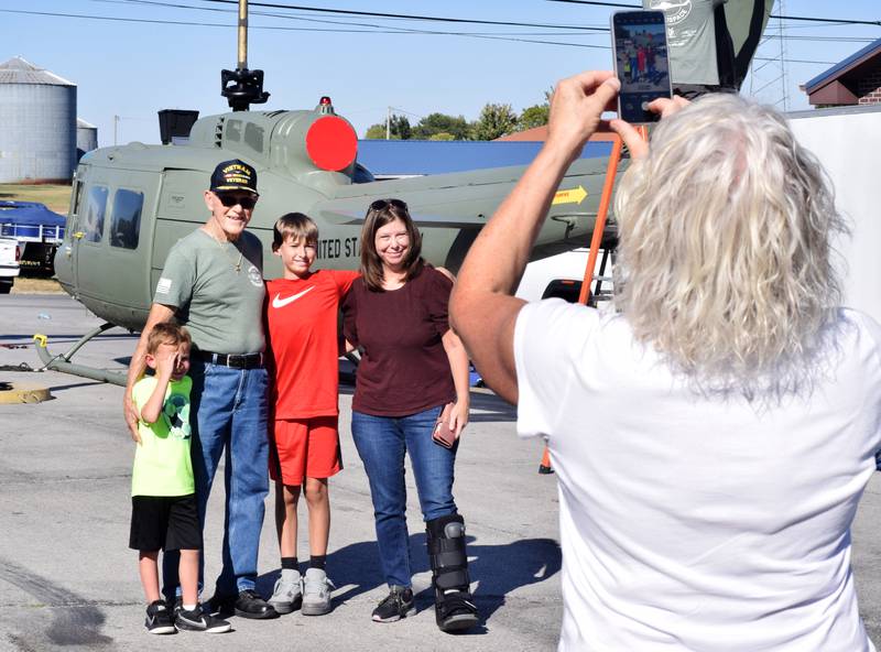 Lynn Harnden, a retired Lt. Colonel of the U.S. Army, poses for pictures during the preparation of the Huey helicopter memorial on Sept. 30 in Baxter.