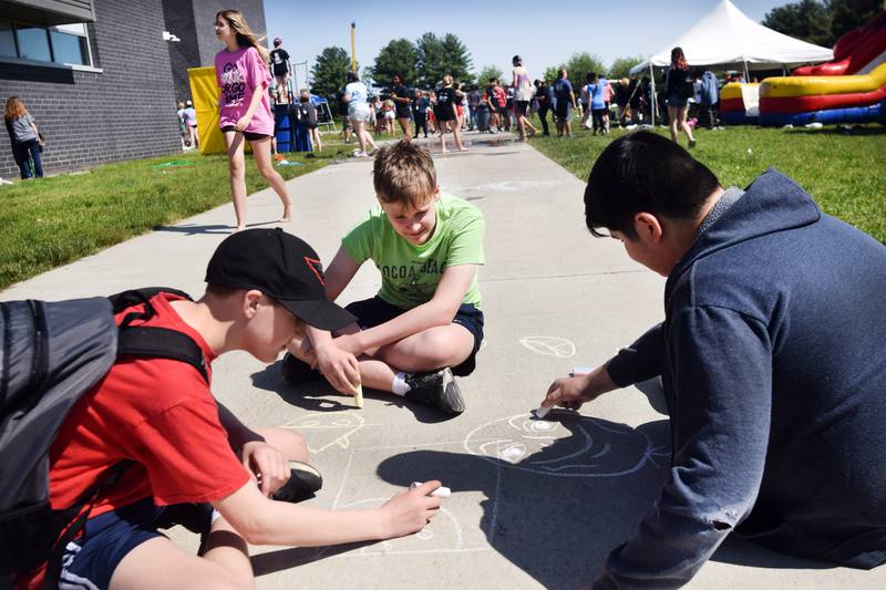 Eighth-grade students at Berg Middle School celebrate their last day as middle schoolers on May 26 by participating in carnival activities.