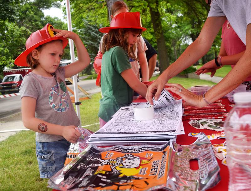 Local first responders show off emergency vehicles and have kids participate in an obstacle course as part of Safety Fest during Newton Fest on Saturday, June 10 at Maytag Park.