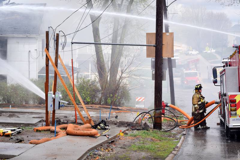 Firefighters from multiple agencies in Jasper and Polk Counties respond to a house fire on Thursday, April 20, near the 300 block of South Walnut Street in Colfax.