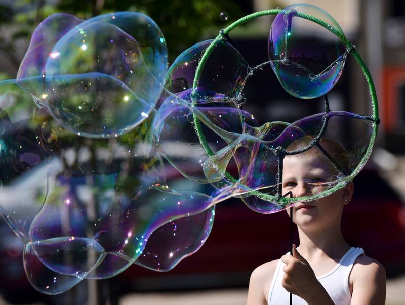 Lots of children participate in the Absolute Science Bubble Open House on June 20 at the Newton Public Library.