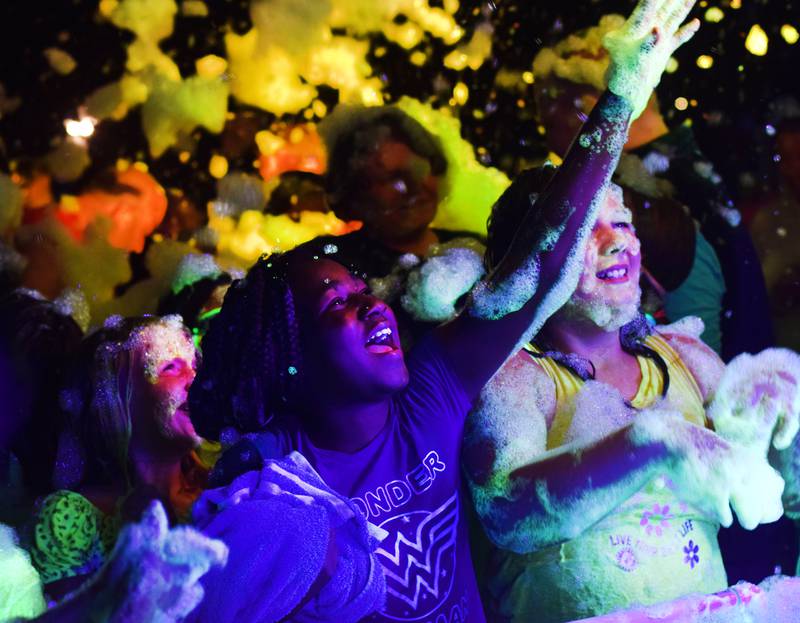 Kids enjoy the return of the Glow Foam Party – which featured two cannons this year – during Newton Fest on June 7 at Maytag Park.