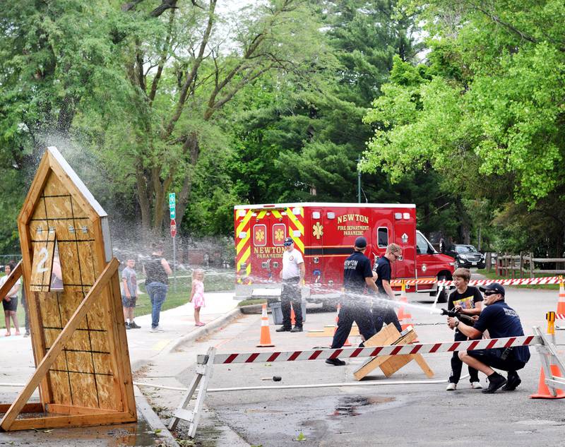 Local first responders show off emergency vehicles and have kids participate in an obstacle course as part of Safety Fest during Newton Fest on Saturday, June 10 at Maytag Park.