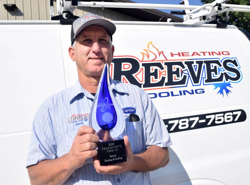 Jack Reeves, owner of Reeves Heating & Cooling, shows off the 2023 President's Award from Carrier. The award was established to recognize Carrier dealers “who exemplify exceptional leadership in business management, customer satisfaction, HVAC expertise and operational excellence.”