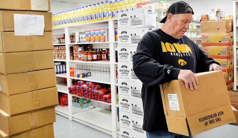Ed Poe, the food pantry coordinator at the Salvation Army, unloads food and breaks down boxes. FNNB Bank has started a food drive for the Salvation Army, allowing people to drop off nonperishable food items at the bank lobby before Nov. 20.