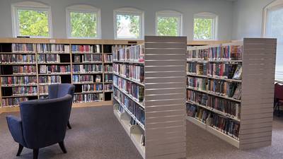 Library updates area with shelving and chairs