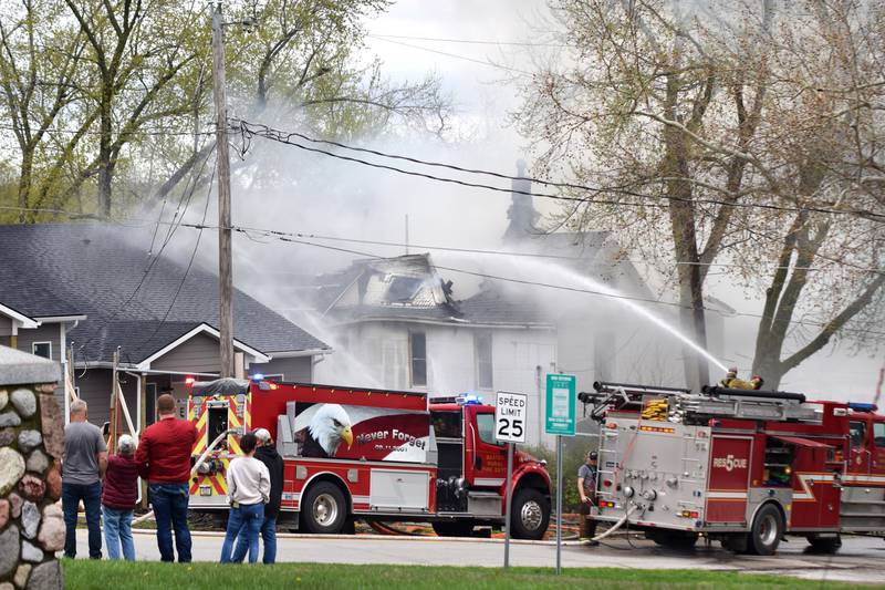 Firefighters from multiple agencies in Jasper and Polk Counties respond to a house fire on Thursday, April 20, near the 300 block of South Walnut Street in Colfax.