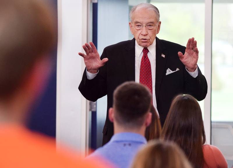 U.S. Sen. Chuck Grassley, R- Iowa, speaks with workers of VanMaanen Electric, Inc. during his 99-county tour on May 13 in Newton.