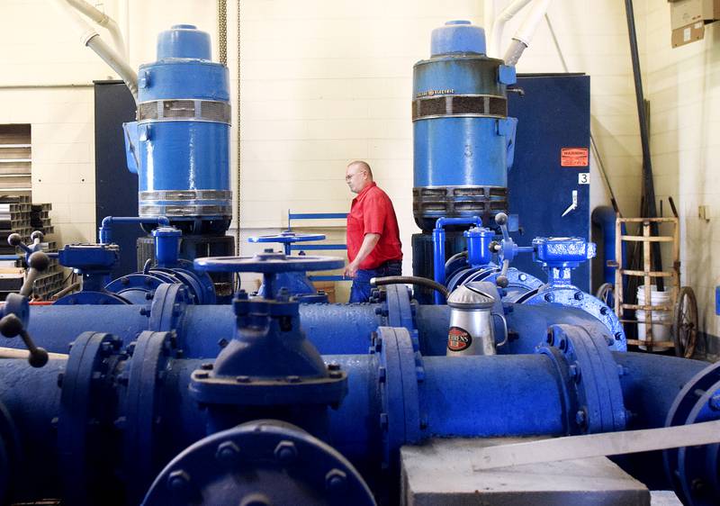 Todd Pierce, supervisor of the Newton WaterWorks Treatment Plant, inspects equipment operating at the water treatment facility.