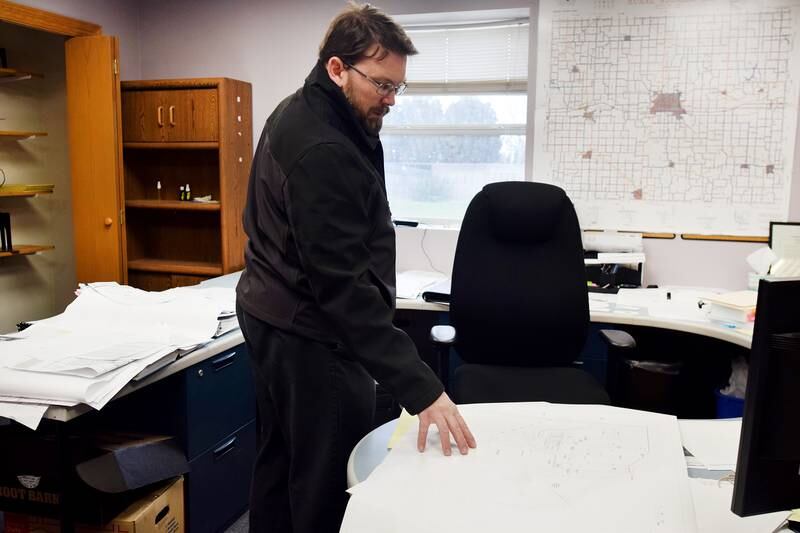 Jasper County Engineer Michael Frietsch looks at the maps of the proposed new secondary roads yard. The board of supervisors on Oct. 25 approved an architectural-engineering agreement that would get firm costs for the project, which is expected to be millions of dollars.