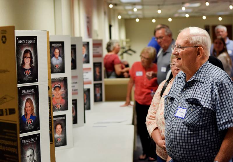 Newton High School graduates gather for drinks and camaraderie at the all-class reunion June 7 at Legacy Plaza. Newton Alumni Weekend brought back Cardinals for a weekend of partying and fellowship.