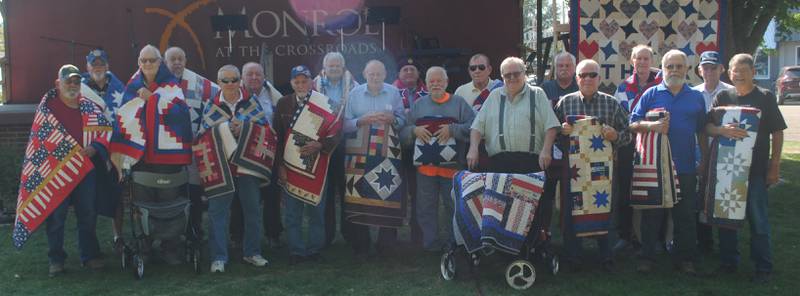 Veterans honored during the Oct. 6 Quilts of Valor Presentation in Monroe include: (back row) Michael Conejo, Jason Stock, Jeff Stock, Darrin Dixon, Doug Duinink, Jason Birkenholtz, Jeff McDermott; (middle row) James Van Maaren, John Carter, Ronald Johnson, Duane Van Veen, Joel Timmins, Chad Phifer, John Timmins, Brian VanGenderen; (front row) Glen Robinson, Lee Eskelson, Teresa Brown, Laura Timmins, Jason Timmins, Matt Timmins, John Duncan, Stephanie Stock