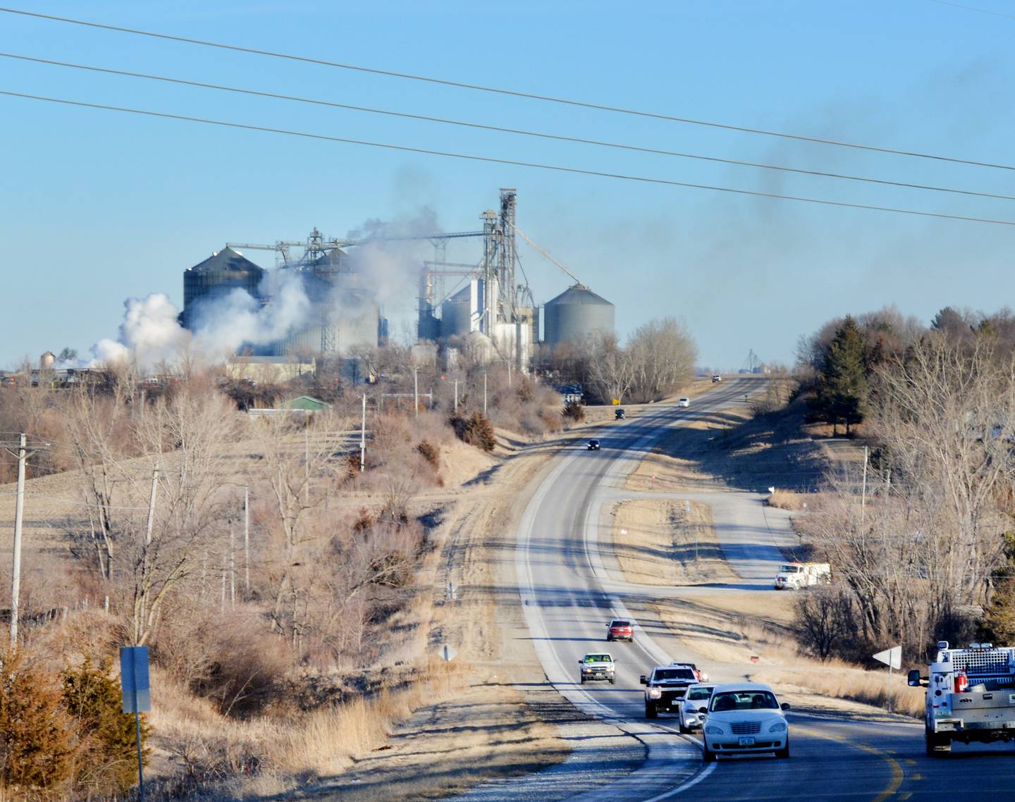 Traffic drives by a structure fire at Heartland Co-op the morning of Jan. 28 in Newton. Newton Fire Chief Jarrod Wellik said the fire caused no injuries, but the building itself is a total loss.