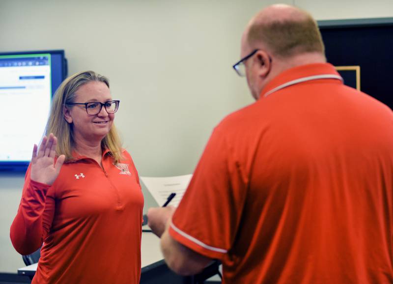 Hilary Foster, left, is sworn in as the newest member of the Newton Community School District Board of Education during its Nov. 24 meeting at E.J.H. Beard Administration Center.