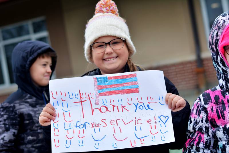 Newton Community School District students and staff participate in a Veterans Day Reverse Parade on Nov. 11, which extended to a number of school buildings in the area.