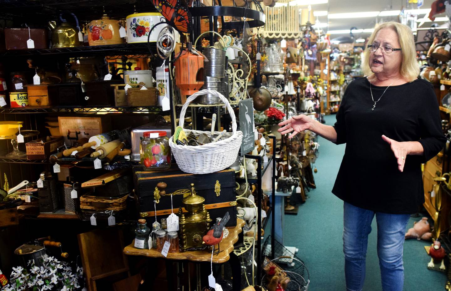 Diane Versendaal showcases a number of items available at Varieties, an arts, antique and treasures shop in downtown Newton. Ever since it opened early 2020, the owners have noticed many of their customers are coming from out-of-town and out-of-state areas.