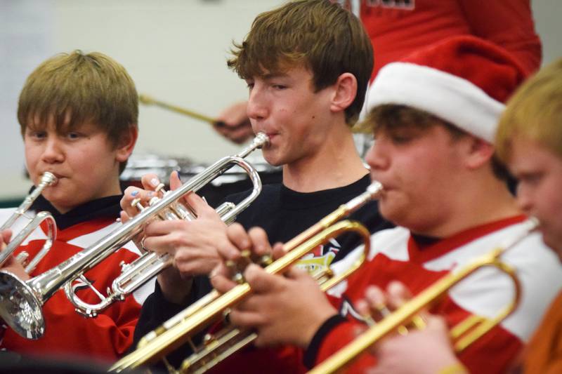 Newton alumni and students have a jam session on Dec. 16 in the band room of Newton High School. Current and past members of the Newton High School band on Dec. 16 participated in the inaugural Alumni Pep Band Night. Adam Kallal, the band director at Newton High School, organized the event in hopes it would become an annual celebration.