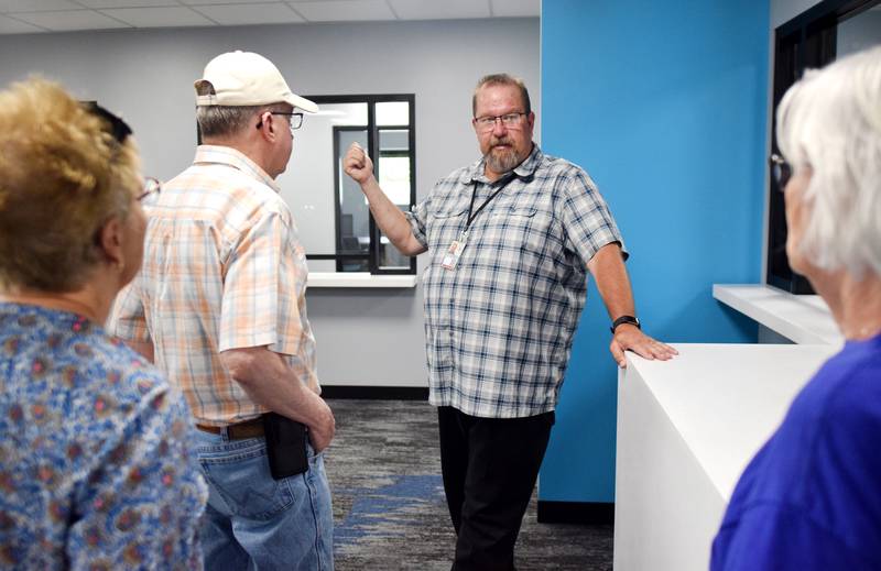 Jasper County Treasurer Doug Bishop speaks to visitors during a past open house of the new county administration building. Bishop and county maintenance director Adam Sparks expect staff will move in by July 18 or 19, provided the new offices pass the fire inspection.