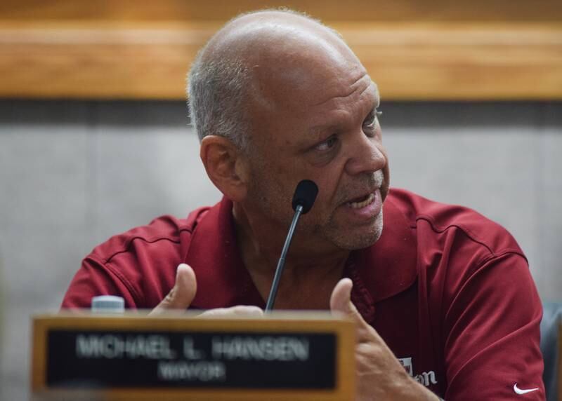 Newton Mayor Mike Hansen explains to city council members on Aug. 1 how Newton Development Corporation will purchase the property at 1311 First Ave. E. and will maintain it until it is sold to a potential developer.