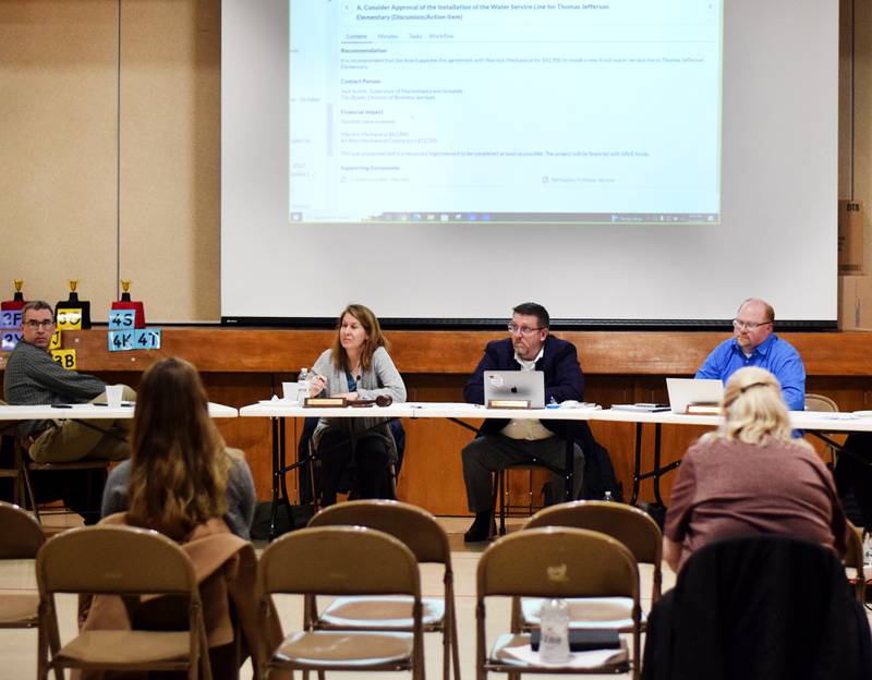 School board members and the Newton superintendent on Feb. 13 listen to an update about the water line issues at Thomas Jefferson Elementary School. The school board authorized the replacement of the water line, which is experiencing a leak and very low pressure.