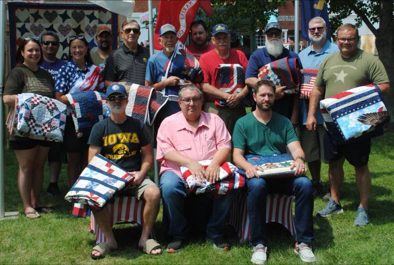 Front row, from left: Dee Clark, Michael Doty, Captain Andrew Parsons; back row, from left: Erika Nolin Baumgardner, Adam Nolin, Mary Jane Kuiken, Andrew Nolin, Ray Vander Velden, Val Thompson, Brian Nolin, John Huetter, Mark Huetter, Matt Huetter, Eric Burns