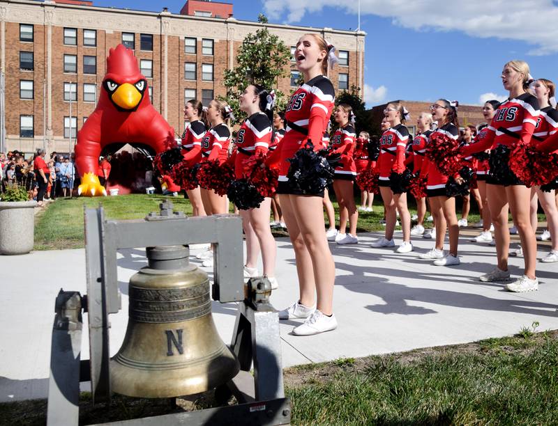 Cheerleaders perform a routine during a pep rally Sept. 4 outside the Jasper County Courthouse in downtown Newton.