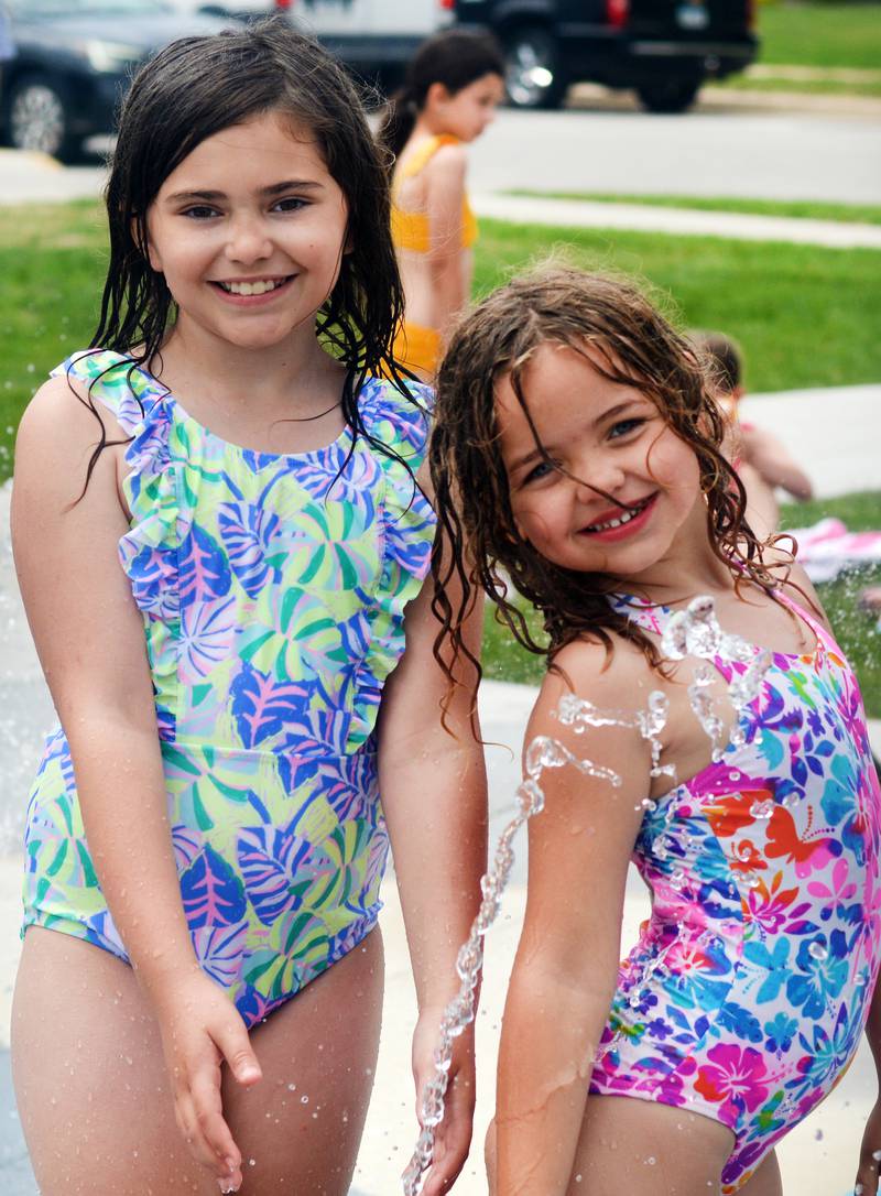 Families and children enjoy the new splash pad facilities. The Greater Newton Area Chamber of Commerce, Newton Main Street and the City of Newton held a ribbon cutting ceremony for the splash pad on June 6.