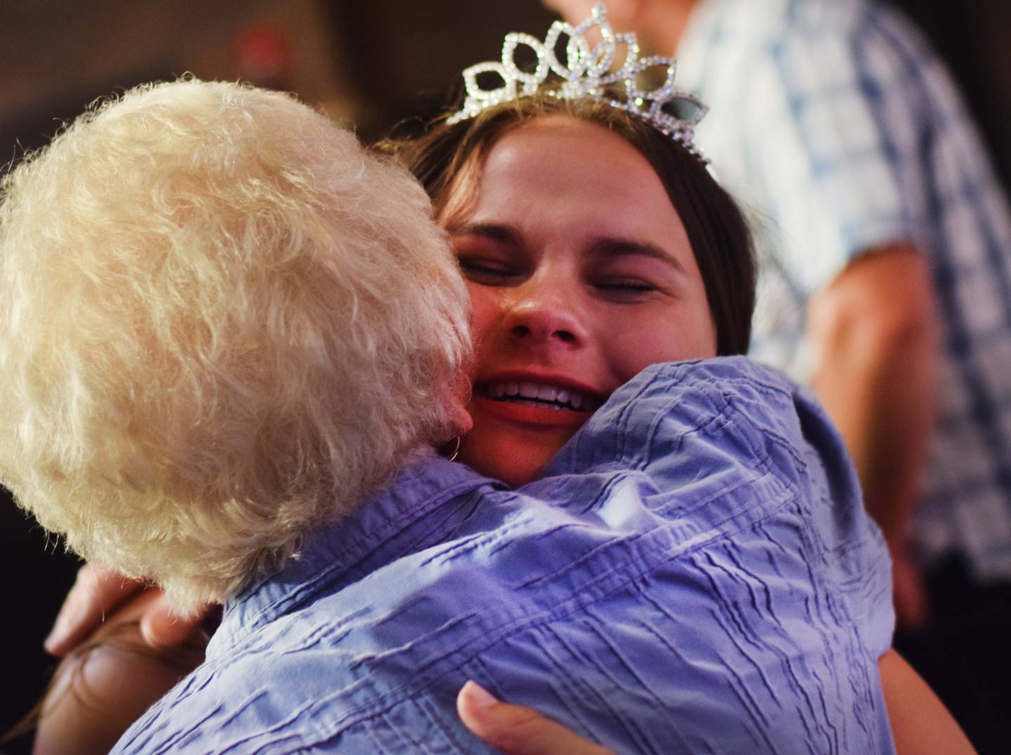 Jocelyn Harder hugs loved ones after being crowned the 2023 Jasper County Fair Queen during the fair queen contest on June 24 at the Newton Community Theatre.
