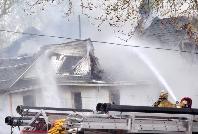 Firefighters from multiple agencies in Jasper and Polk Counties respond to a house fire on Thursday, April 20, near the 300 block of South Walnut Street in Colfax.