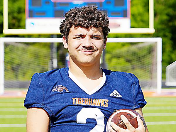Earlham runs past Colfax-Mingo football on its Homecoming