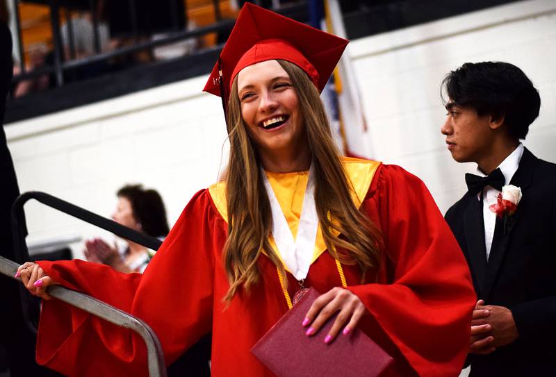 The Newton High School Class of 2024 seniors walk the stage during commencement on May 19 inside the high school gymnasium.