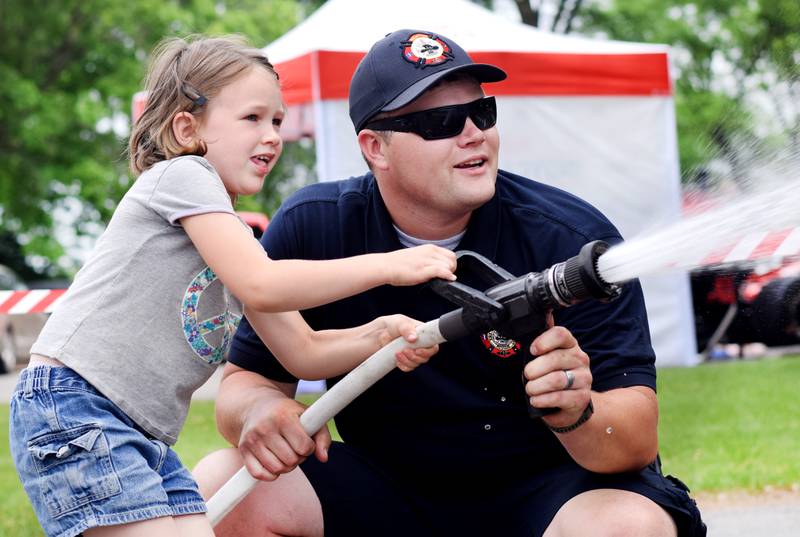 Local first responders show off emergency vehicles and have kids participate in an obstacle course as part of Safety Fest during Newton Fest on Saturday, June 10 at Maytag Park.