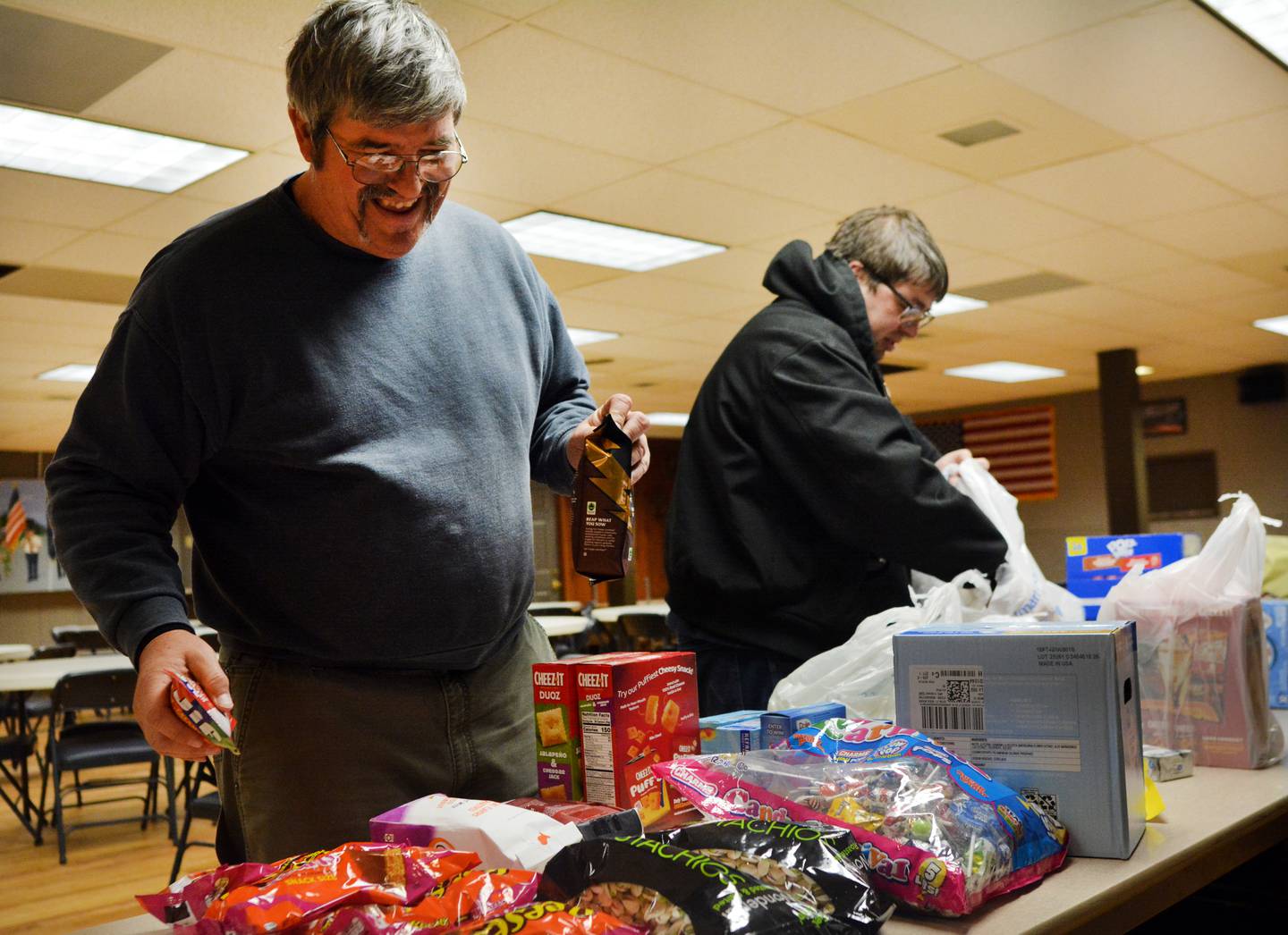 Volunteers and veterans participate in a care package event Monday, Dec. 29, 2025 at the American Legion Post 111 in Newton. The care packages will be going to the unit of the two Iowa National Guard soldiers who were killed in action in Syria.