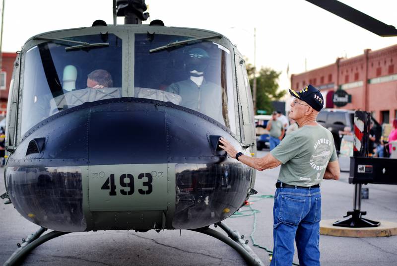 Lynn Harnden, a retired Lt. Colonel of the U.S. Army, gives the Huey helicopter one last look up close before it finds its new home on a raised platform in Baxter.