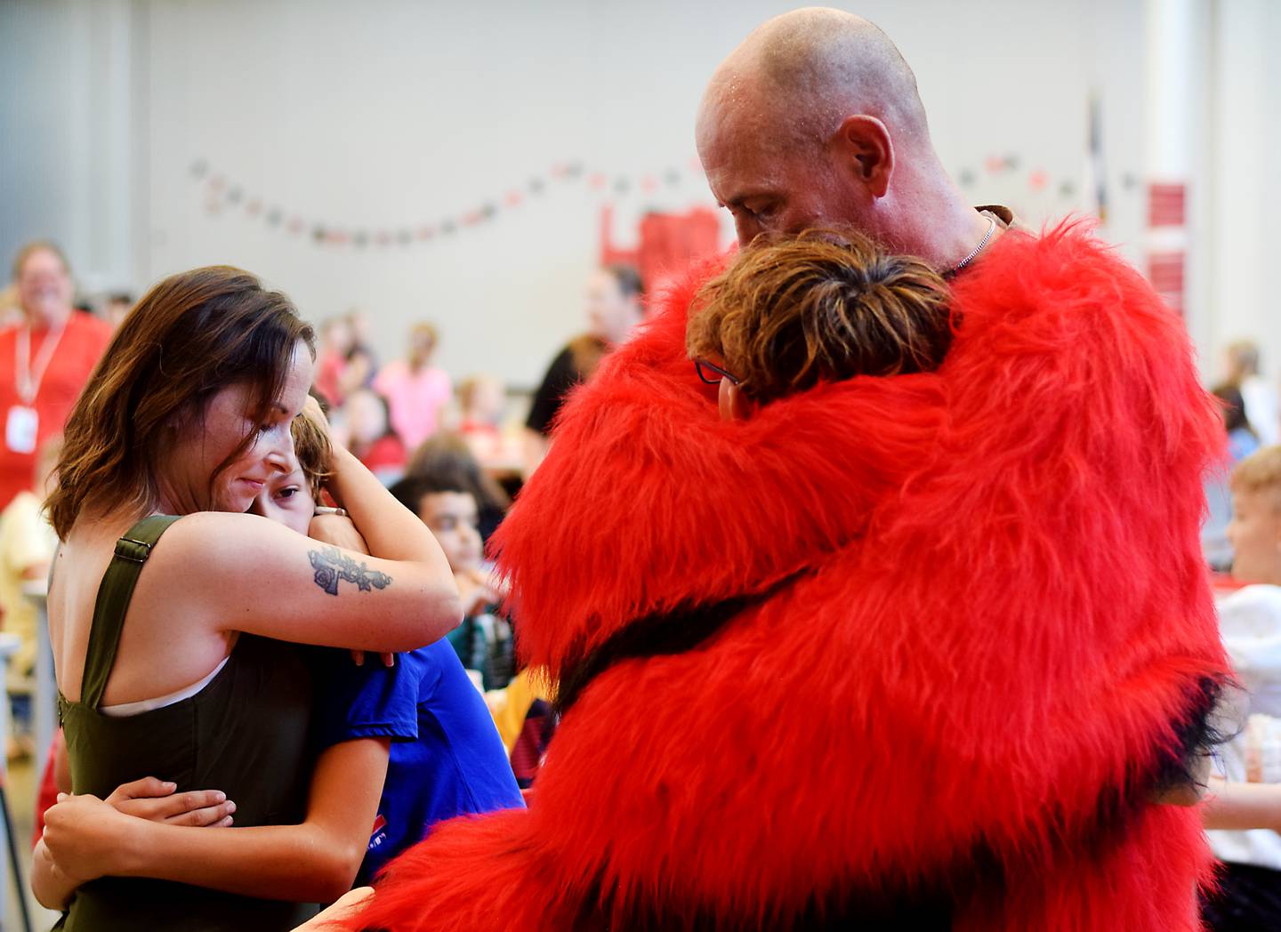 The Richards family reunite after Cody Richards, a sergeant first class in the U.S. Army who finished his fourth and last deployment, surprised his sons Jaiden and Sam while at school disguised as Big Red, the school district's mascot.