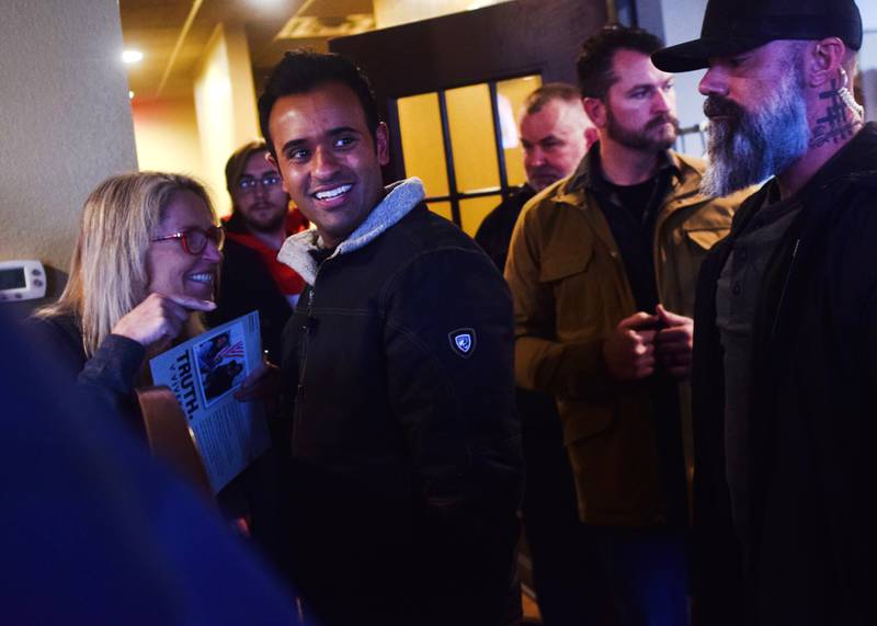 Vivek Ramaswamy, a Republican president candidate, visits with guests during a Jan. 3 commit-to-caucus event at Okoboji Grill in Newton.