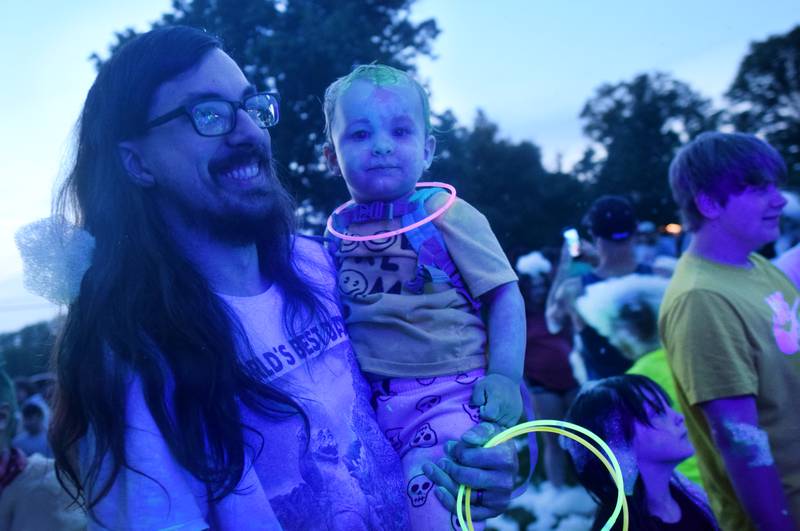 Kids participate in Driving Cap Entertainment's UV Glow Foam Party during Newton Fest on June 9 in Maytag Park in Newton.