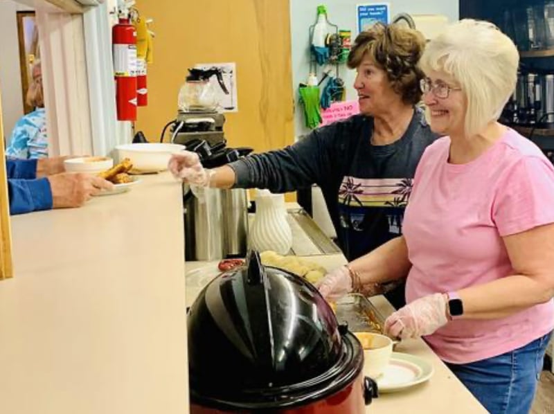 Volunteers serve a free meal every Wednesday at the First United Methodist Church in Newton.