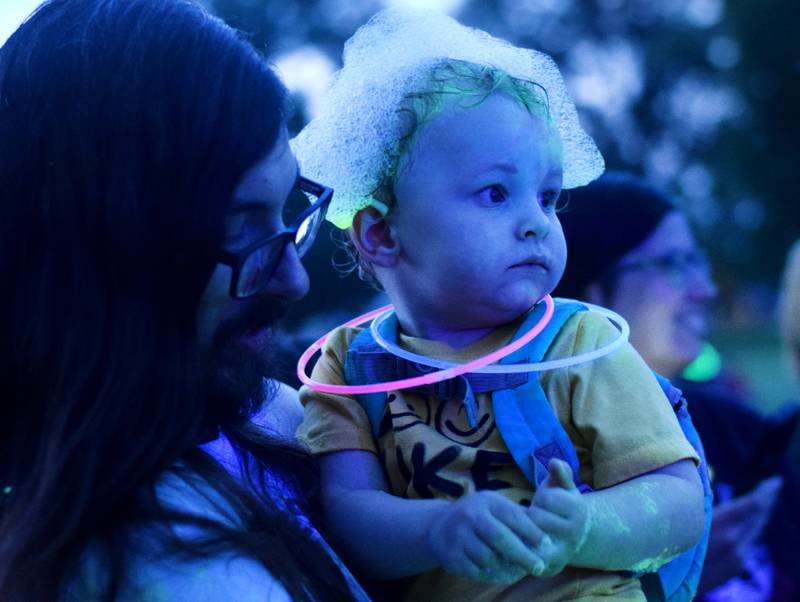 Kids participate in Driving Cap Entertainment's UV Glow Foam Party during Newton Fest on June 9 in Maytag Park in Newton.