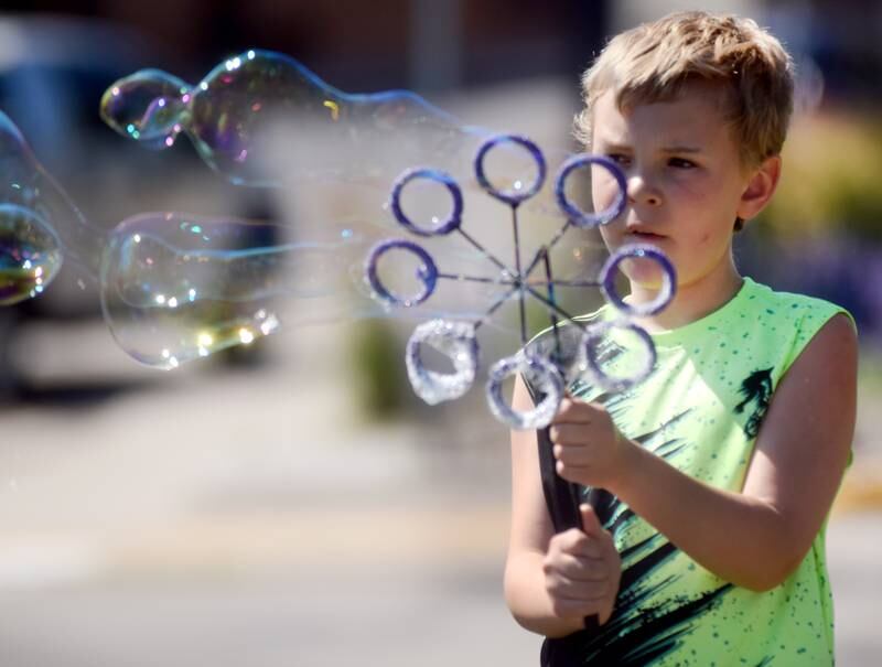 Lots of children participate in the Absolute Science Bubble Open House on June 20 at the Newton Public Library.